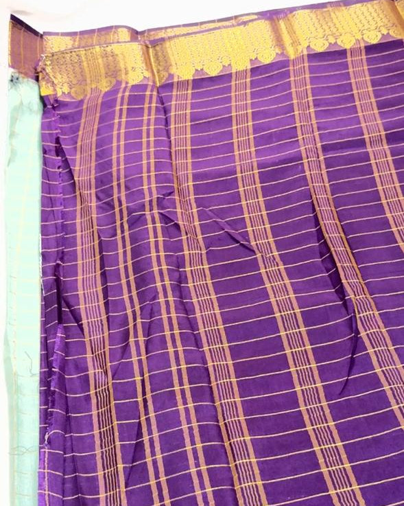 Purple and gold checkered fabric with a plain background