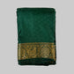 Green saree with gold border on a white background
