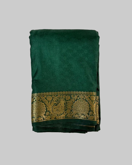 Green saree with gold border on a white background