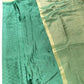 Green fabric with a gold border on a white background