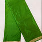Green saree with gold border on a white background