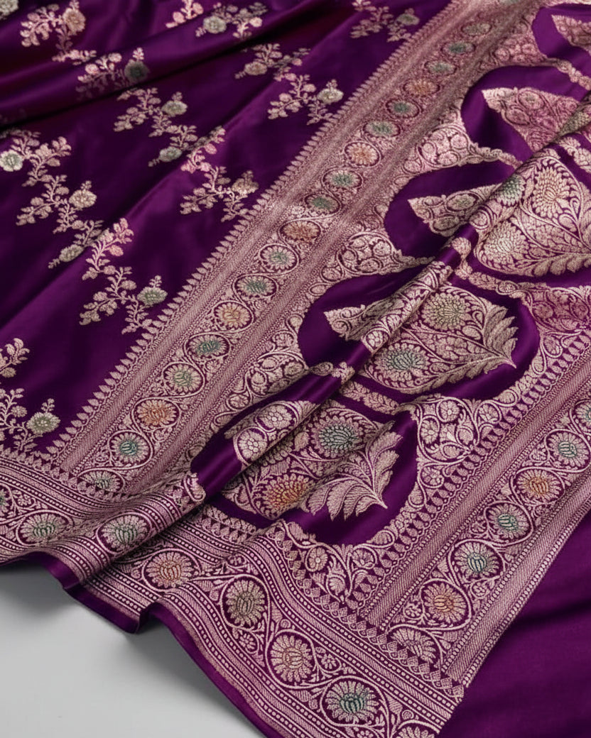 Purple fabric with intricate embroidery on a white background
